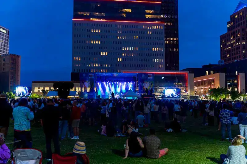 Rochester International Jazz Festival crowd at Parcel 5 outdoor stage in downtown Rochester at night