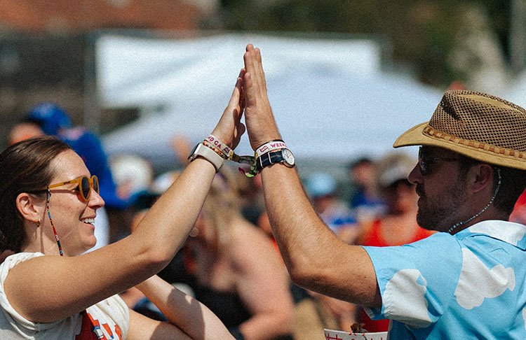 Festival attendees celebrating at Borderland Music and Arts Festival at Knox Farm State Park in East Aurora NY