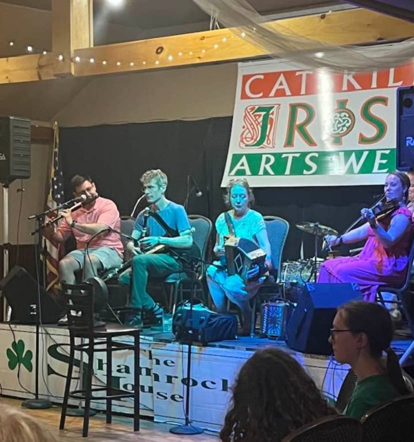 Traditional Irish musicians performing on stage at Catskills Irish Arts Week in East Durham, New York