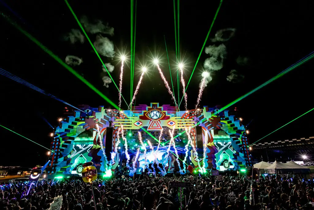 Elements Music and Arts Festival stage with pyrotechnics and crowd at Pocono Raceway