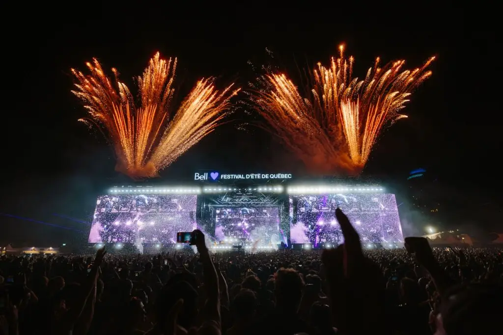 Massive crowd and fireworks at the Bell Stage during Festival d'ete de Quebec on the Plains of Abraham