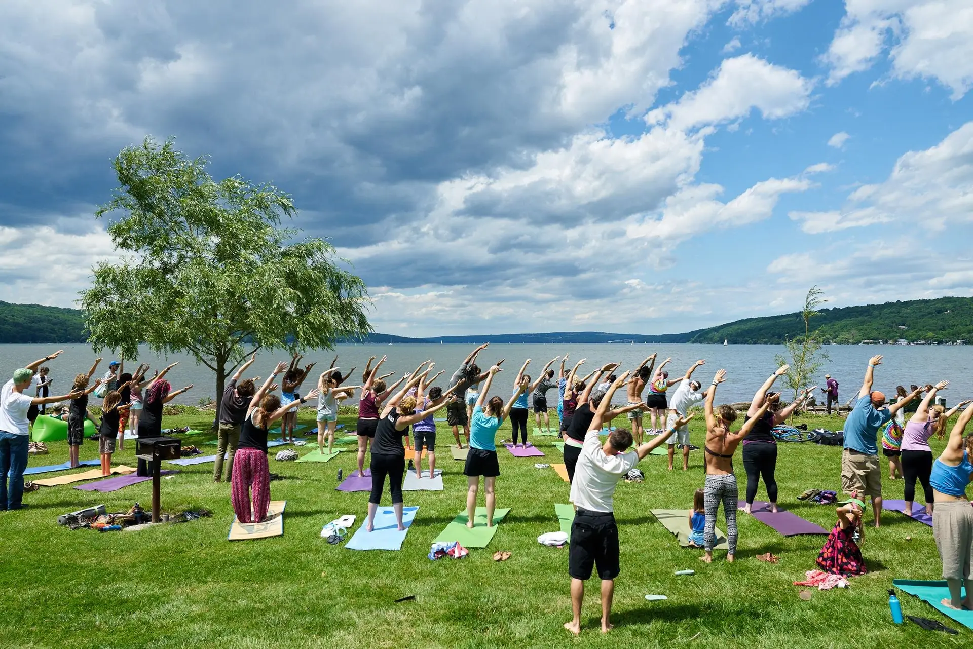 Crowd enjoying live reggae music at the Ithaca Reggae Fest in Stewart Park on the shores of Cayuga Lake