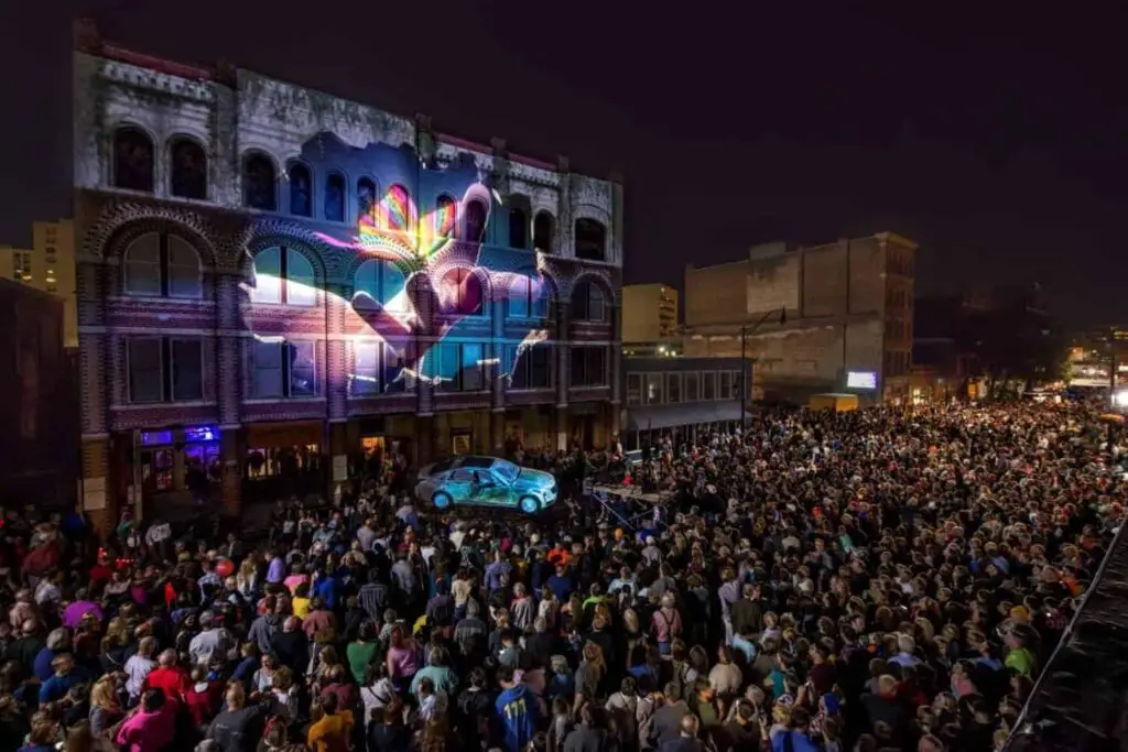 Colorful light projections on buildings during the LUMA Festival in downtown Binghamton NY