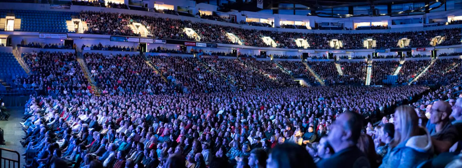 Interior of Mohegan Arena at Casey Plaza during a concert showing the packed arena bowl with stage lighting and crowd