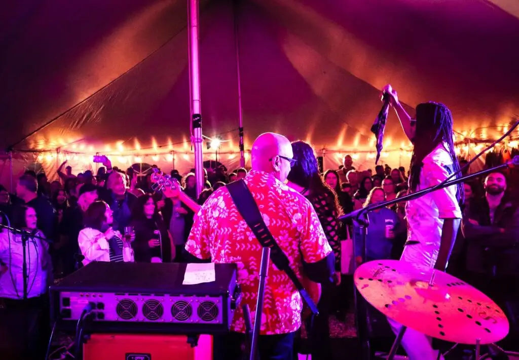 Live band performing inside a tent at the Montauk Music Festival on Long Island