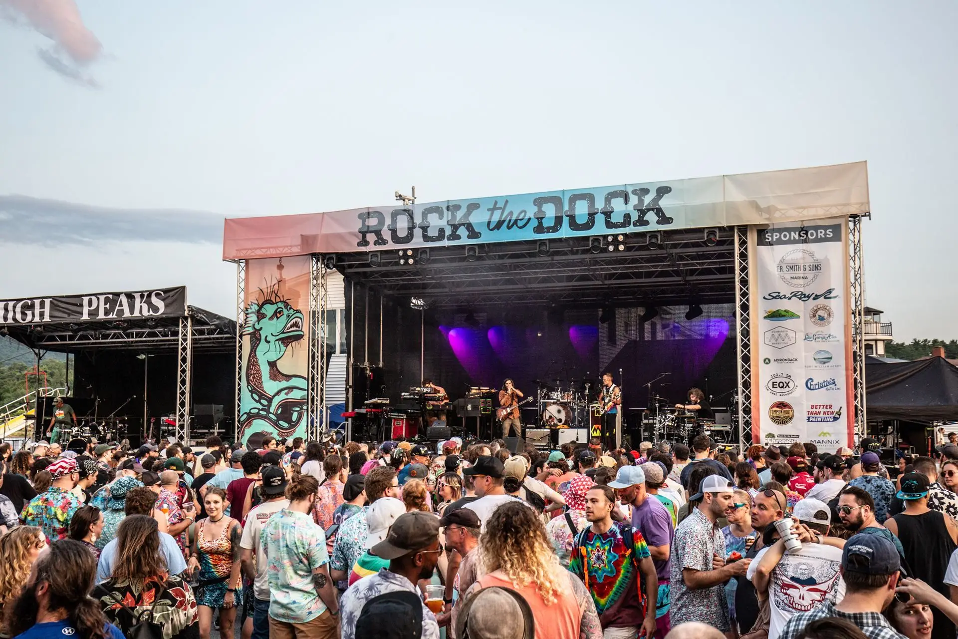 Band on stage with crowd at Rock the Dock Music Festival in Lake George NY