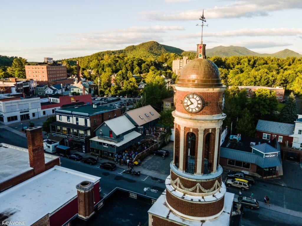 Waterhole Music Lounge building exterior on Main Street in Downtown Saranac Lake with Town Hall visible
