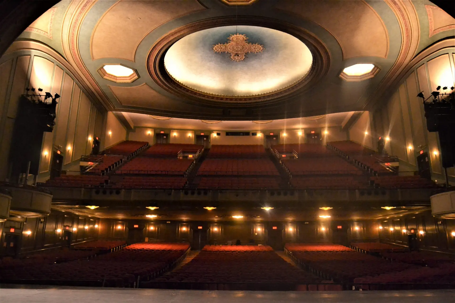 West Herr Auditorium Theatre interior view from stage showing ornate ceiling orchestra seating and balcony in Rochester New York