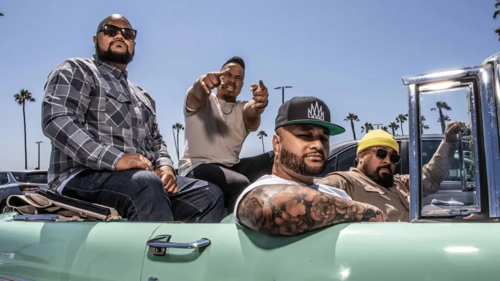 Common Kings pose in a classic convertible — reggae headliners at the Set The Clock Back Fundraiser, Rec Room Buffalo, June 26 2026