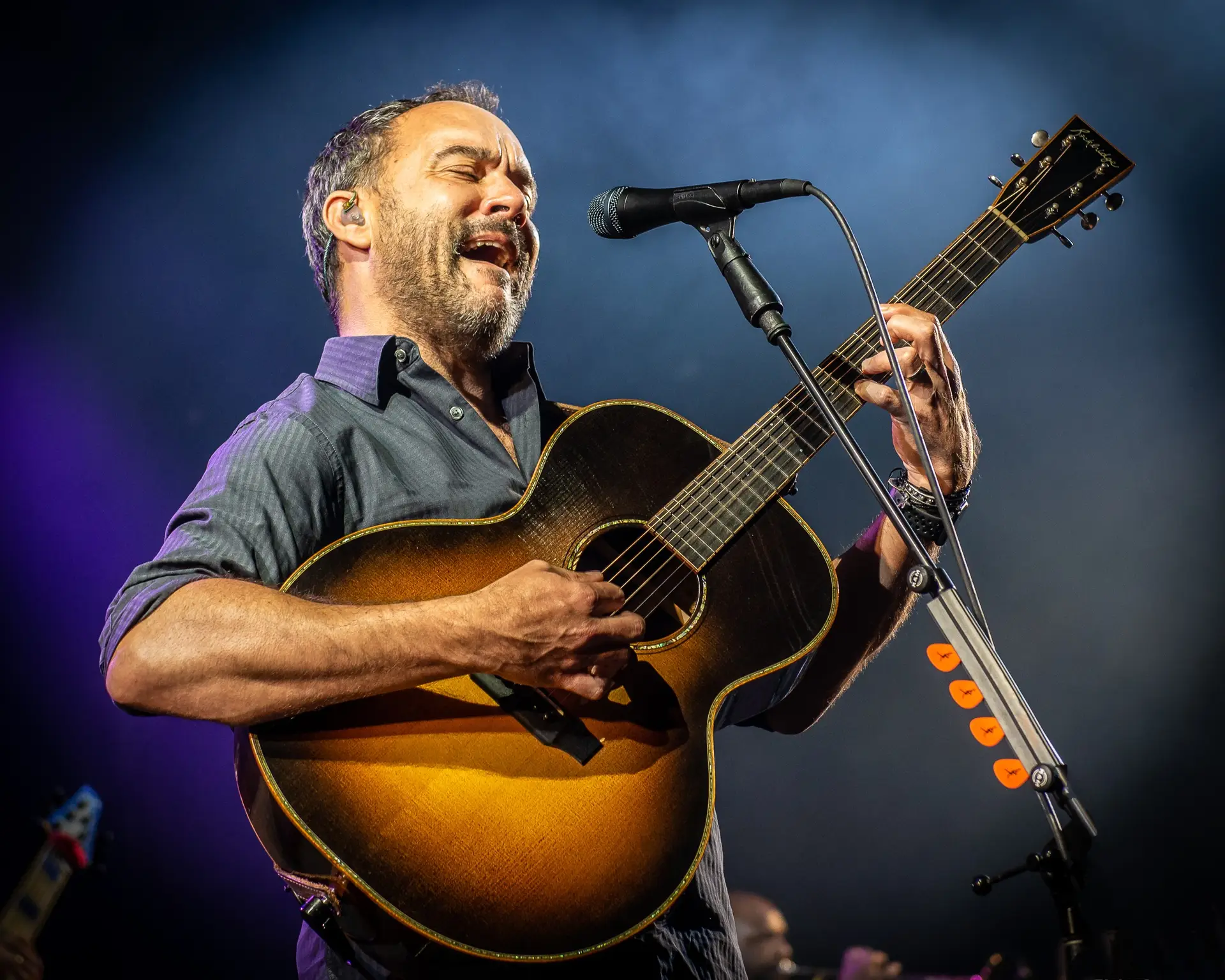 Dave Matthews performing with acoustic guitar at SPAC