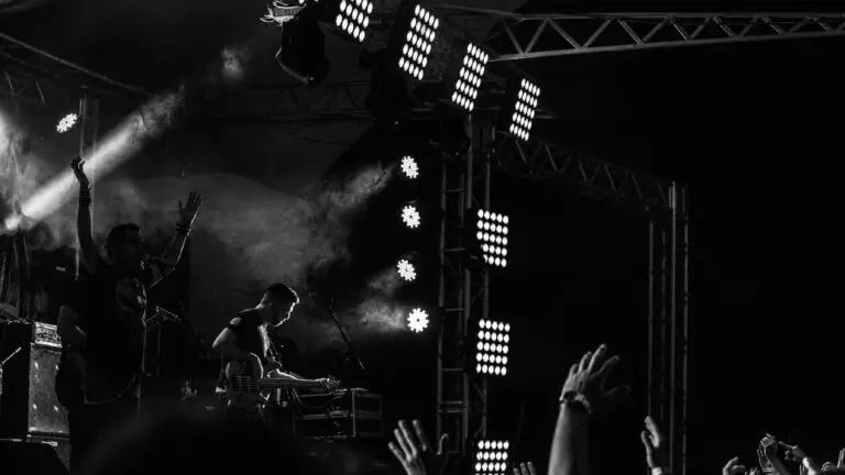 Les Greene & the Swayzees performing live on stage with dramatic stage lighting