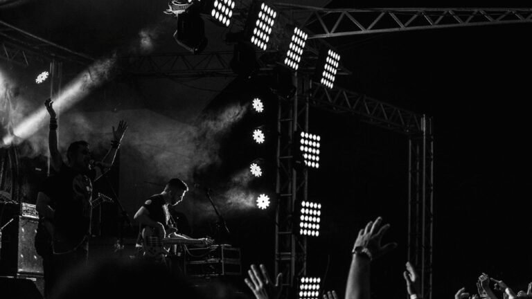 Southpaw FLHC performing live on stage, dramatic concert lighting and crowd with raised hands