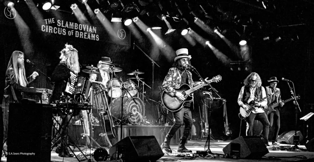 The Slambovian Circus of Dreams performing live on stage, 2025