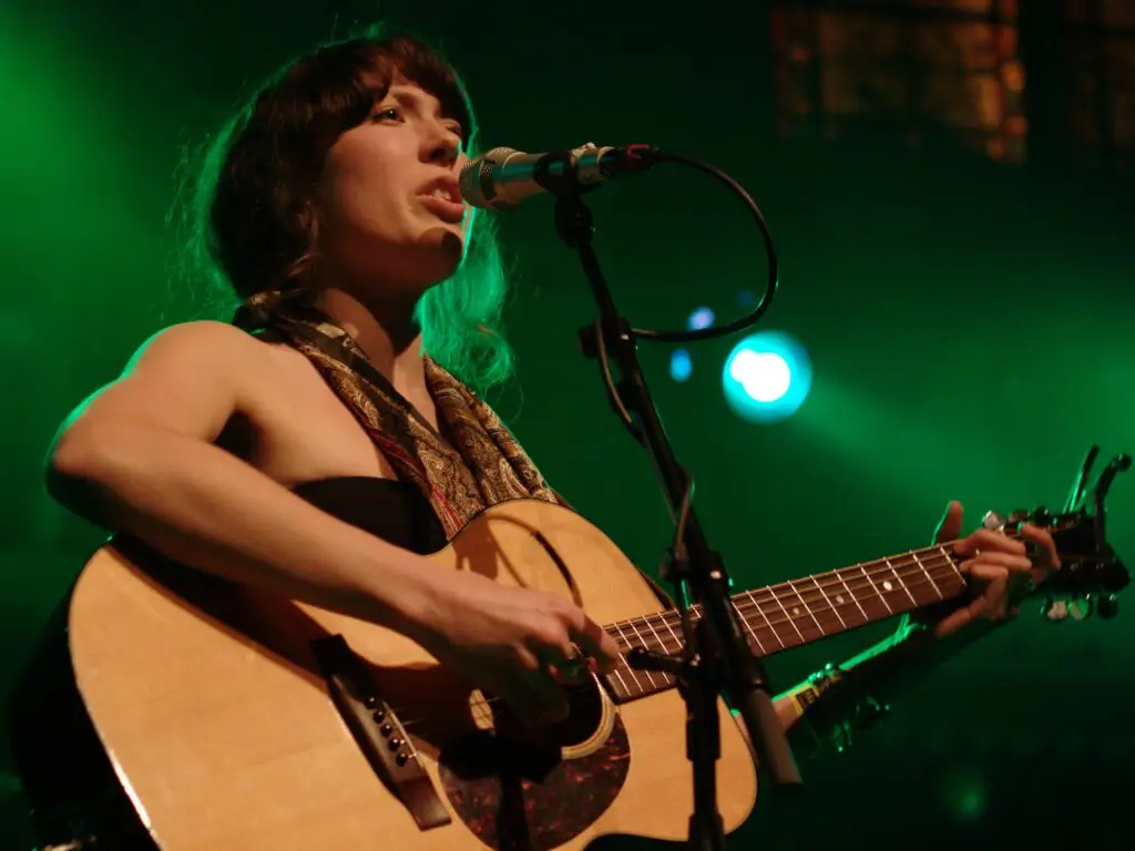 Alela Diane performs live on stage with acoustic guitar at Higher Ground Showcase Lounge
