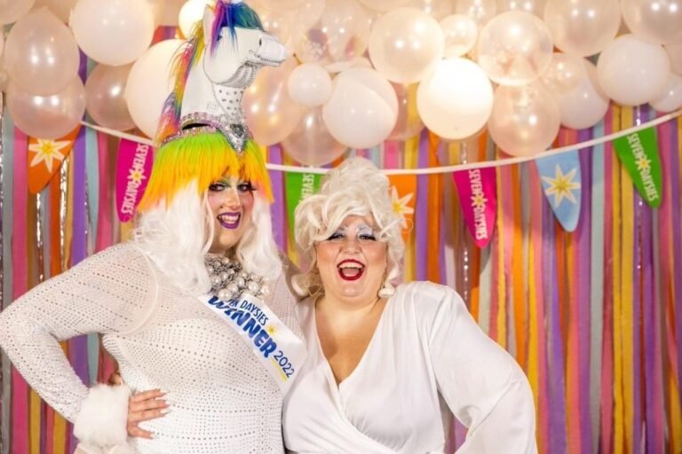 Emoji Nightmare and Katniss Everqueer in drag performance attire at a Vermont event