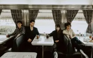 The Felice Brothers band portrait, 2024 — four band members posed informally, Ian Felice and James Felice flanked by bassist Jesske Hume and drummer Will Lawrence.