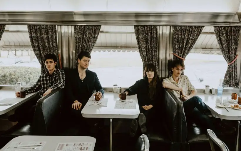 The Felice Brothers band portrait, 2024 — four band members posed informally, Ian Felice and James Felice flanked by bassist Jesske Hume and drummer Will Lawrence.