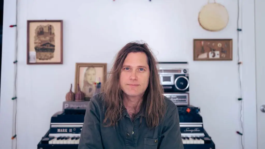 Fruit Bats (Eric D. Johnson) seated at a Rhodes piano — promotional photo for Higher Ground, South Burlington VT