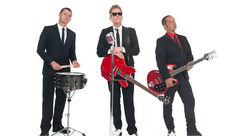 Sugar Ray performs live — Mark McGrath and band members with guitars and drums