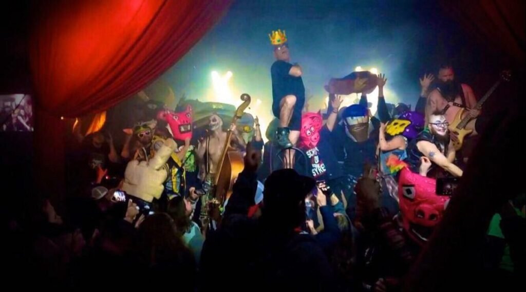 Green Jellÿ performs live on stage in theatrical costumes and animal masks at a club show