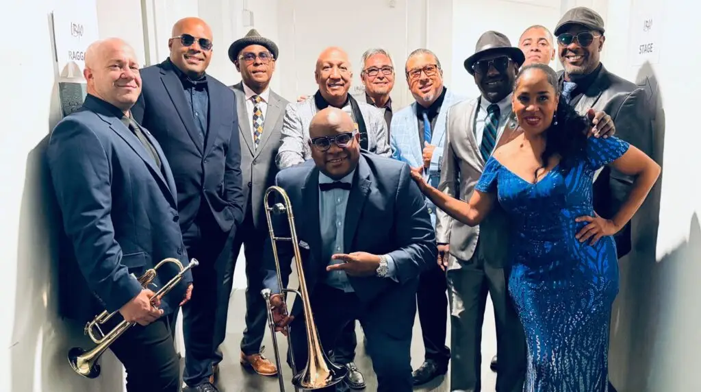 Buena Vista Orchestra performs live — Cuban music ensemble in formal wear with brass instruments