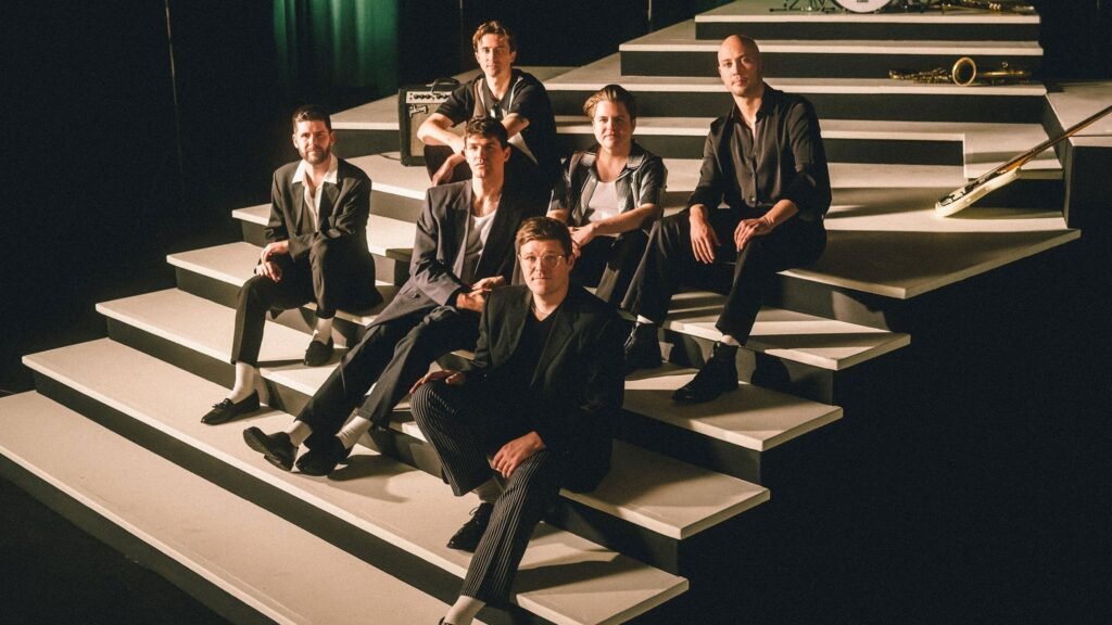 The Dip band promotional photo — six-piece Seattle R&B group with horn section