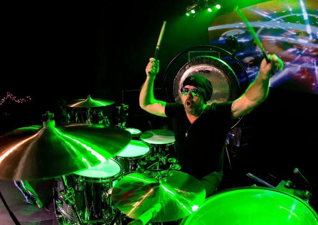 Jason Bonham's Led Zeppelin Evening performing live on stage with dramatic green lighting