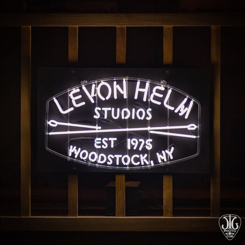 Neon sign for Levon Helm Studios in Woodstock, New York, reading Levon Helm Studios EST 1975 Woodstock NY with crossed drumsticks
