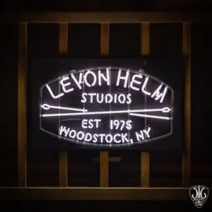 Neon sign for Levon Helm Studios in Woodstock, New York, reading Levon Helm Studios EST 1975 Woodstock NY with crossed drumsticks