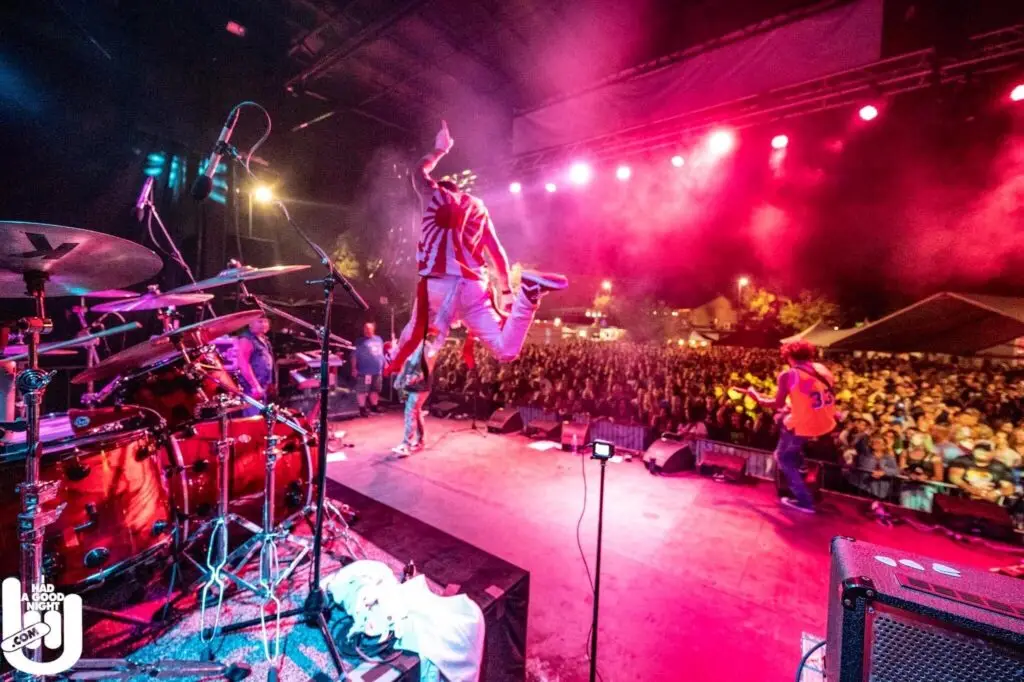 The M80s perform The World's Largest 80s Party live on stage with a packed crowd
