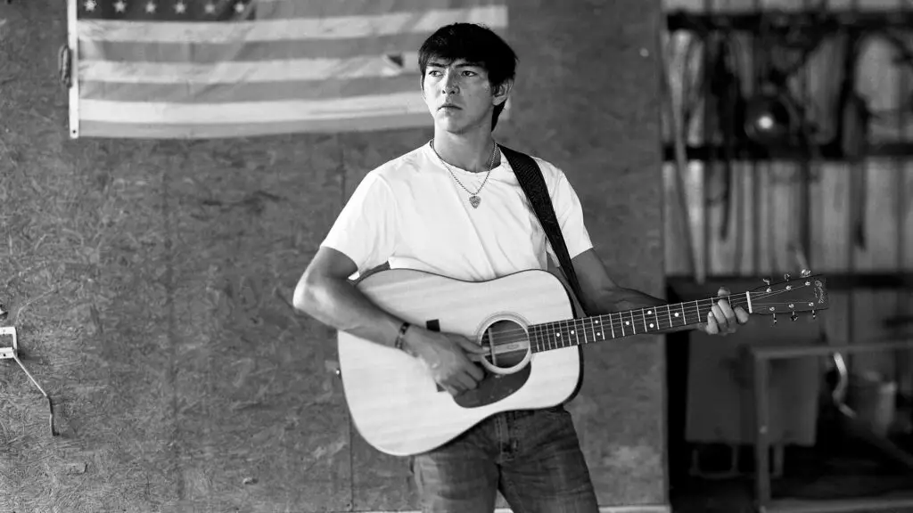 Wyatt Flores performs with acoustic guitar during the Drive All Night Tour
