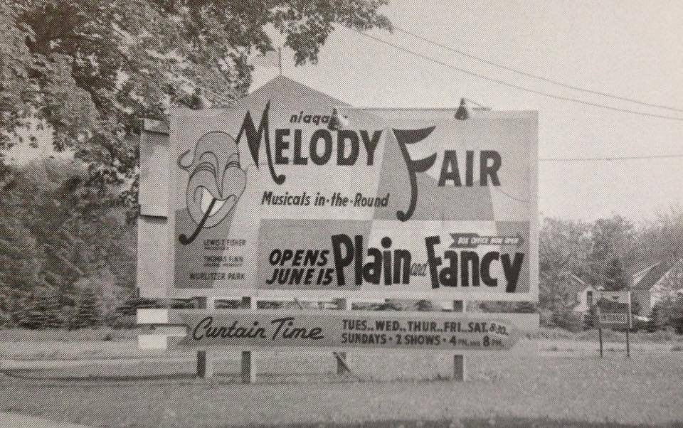 Black-and-white photograph of the Melody Fair roadside billboard sign circa 1958, reading 'niagara MELODY FAIR Musicals-in-the-Round' with a panel advertising the production 'Plain and Fancy.'