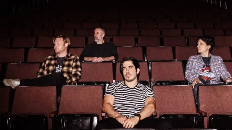 Armor For Sleep band members seated in theater seats — press photo for June 2026 tour