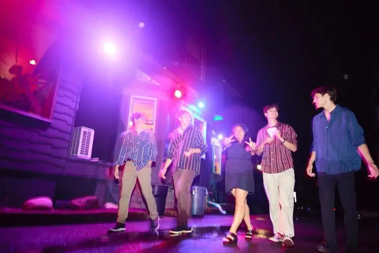 Courtyard band performs under colorful stage lights at Lovin' Cup in Rochester, NY