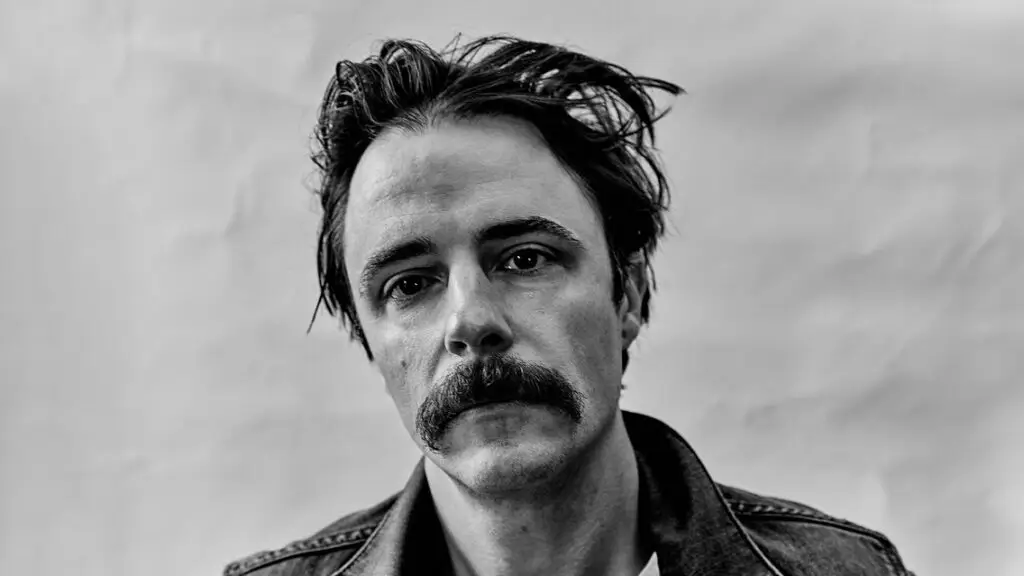 Jonathon Linaberry of The Bones of J.R. Jones in black-and-white press photo, denim jacket