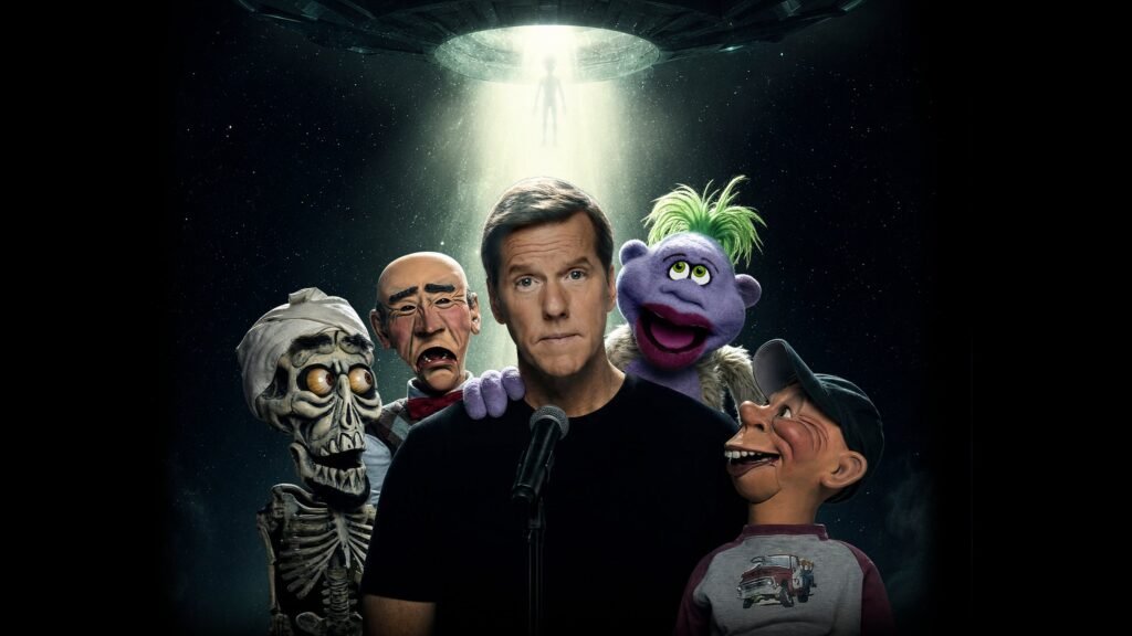 Jeff Dunham with puppet characters Achmed, Walter, Peanut, and Jose at a microphone
