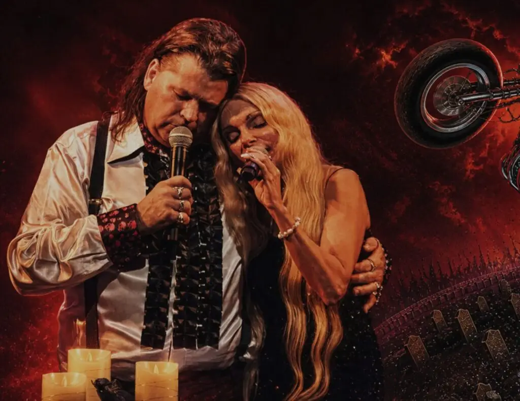 All Revved Up performing as Meat Loaf tribute, two vocalists in theatrical production on stage with candles