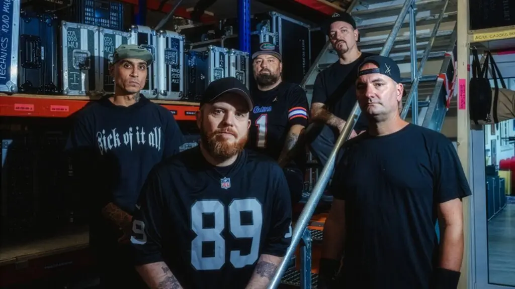 Hatebreed band members pose for official promo photo in backstage warehouse