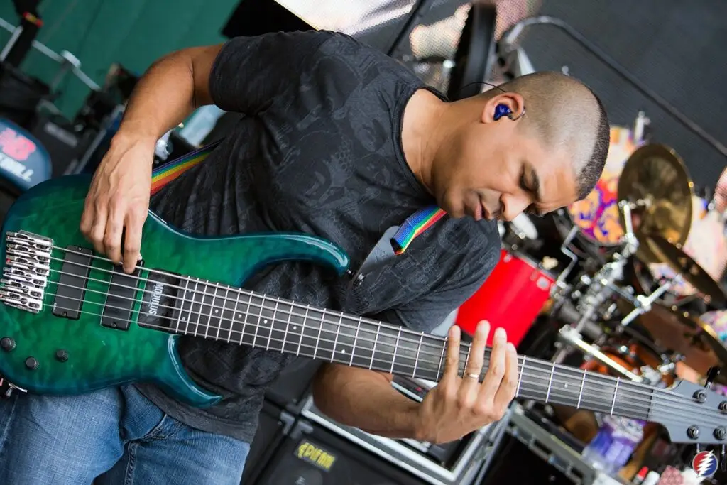 Oteil Burbridge performing live on bass guitar in concert