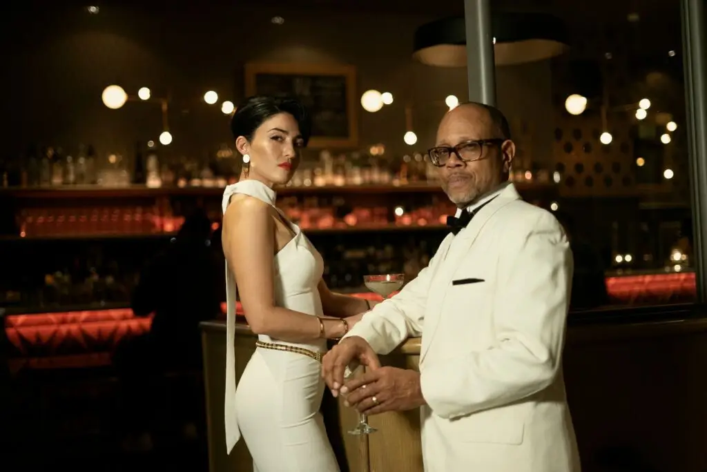 The Espionage Orchestra vocalists Rebecca Noelle and Michael Hanna Sr. in James Bond-style formal attire