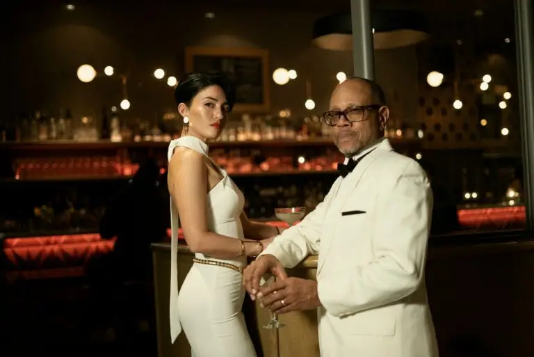 The Espionage Orchestra vocalists Rebecca Noelle and Michael Hanna Sr. in James Bond-style formal attire