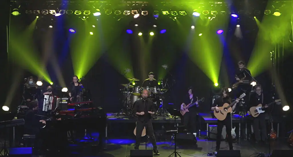 Classic Albums Live ensemble performing The Stranger by Billy Joel on stage with dramatic green stage lighting
