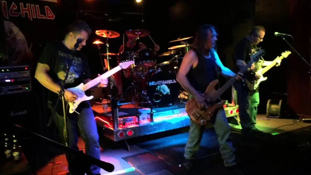 Wrathchild Iron Maiden tribute band performing live on stage with guitarists and drum kit
