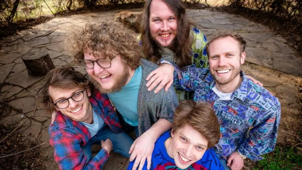 Kendall Street Company band members pose together outdoors in a group shot
