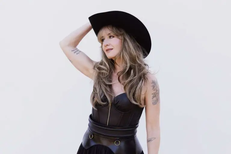 Margo Price in black cowboy hat and leather outfit, official promotional photo for the Wild At Heart Tour