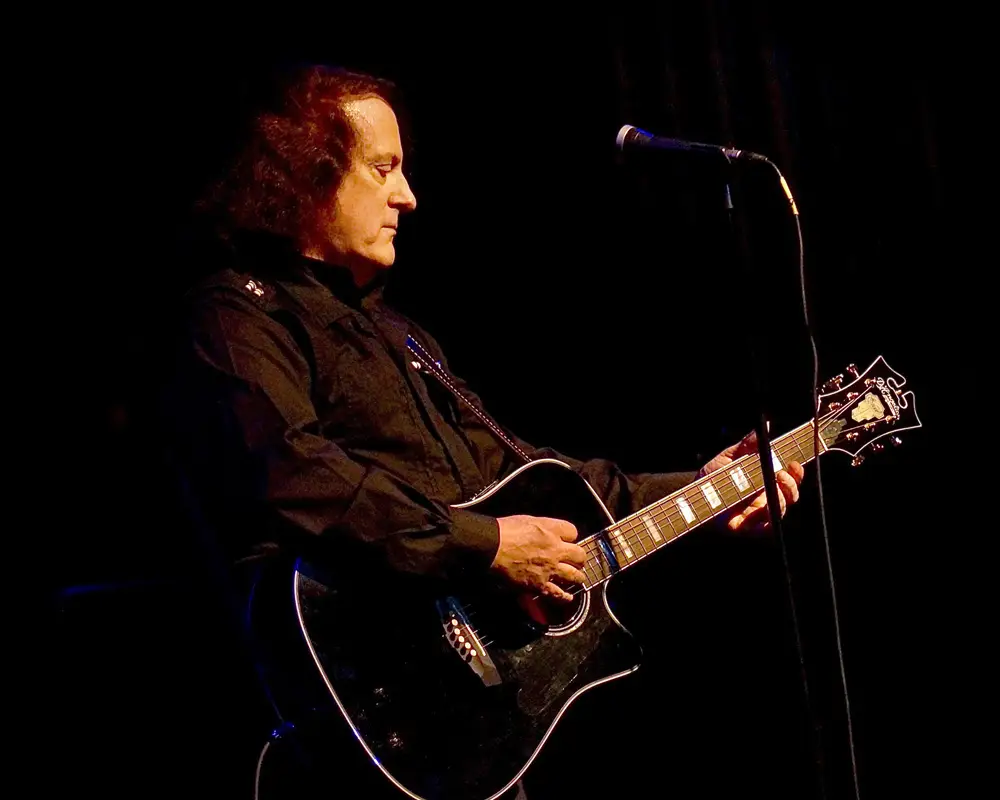 Tommy James performs live on stage with guitar at Riviera Theatre, North Tonawanda NY