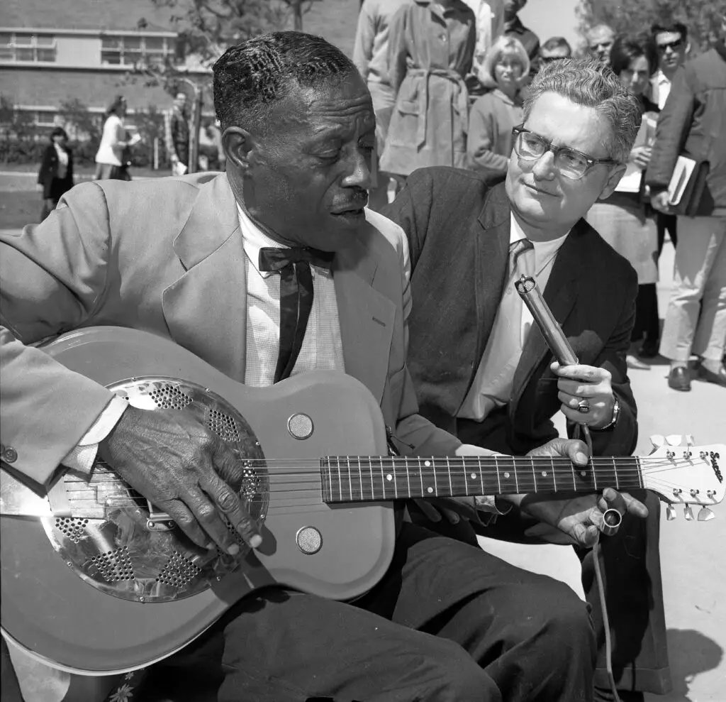 Blues musician Son House playing a resonator guitar