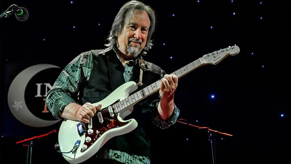 Jim Messina plays guitar on stage at Buffalo State PAC, October 1, 2026