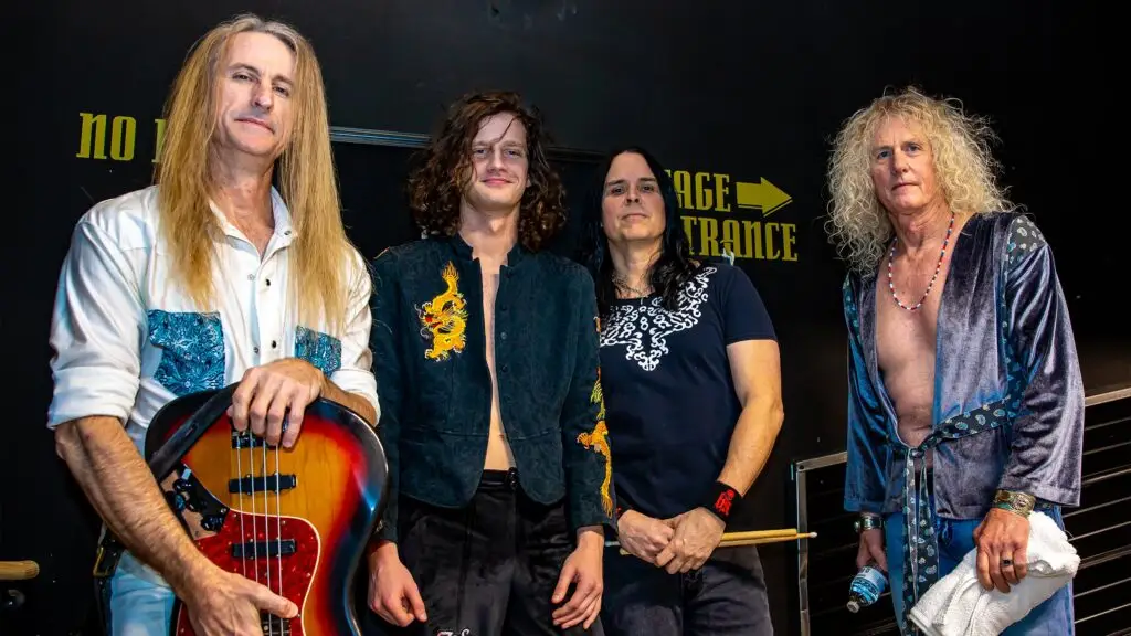 Zoso The Ultimate Led Zeppelin Experience backstage, four members including curly-blonde Robert Plant-persona vocalist