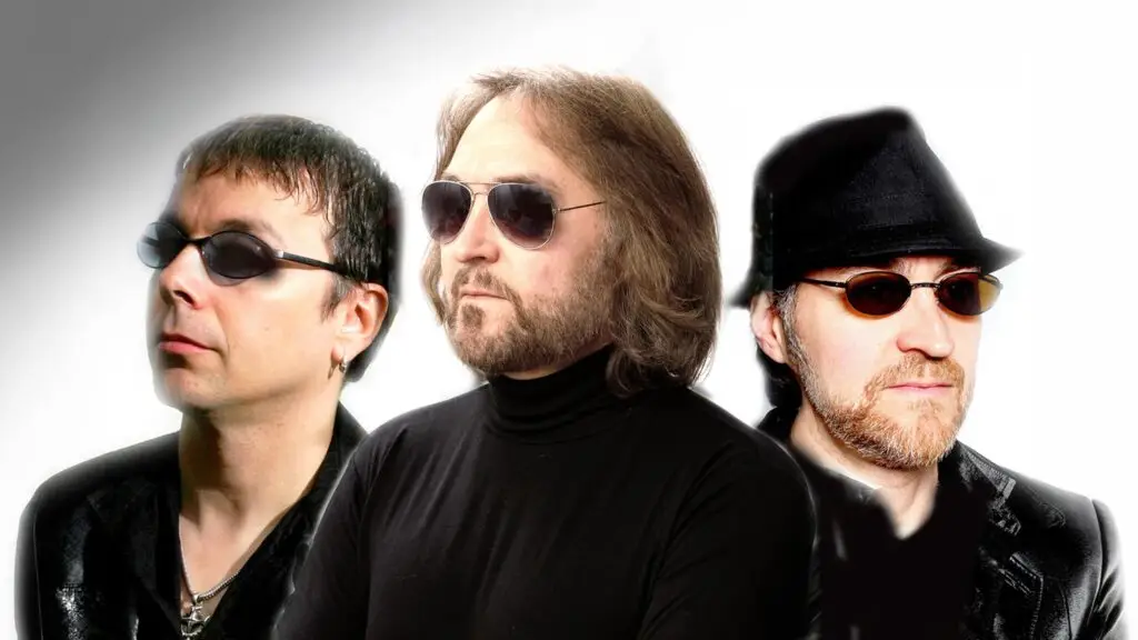 Night Fever Bee Gees tribute performers in promotional photo, three vocalists in sunglasses and black